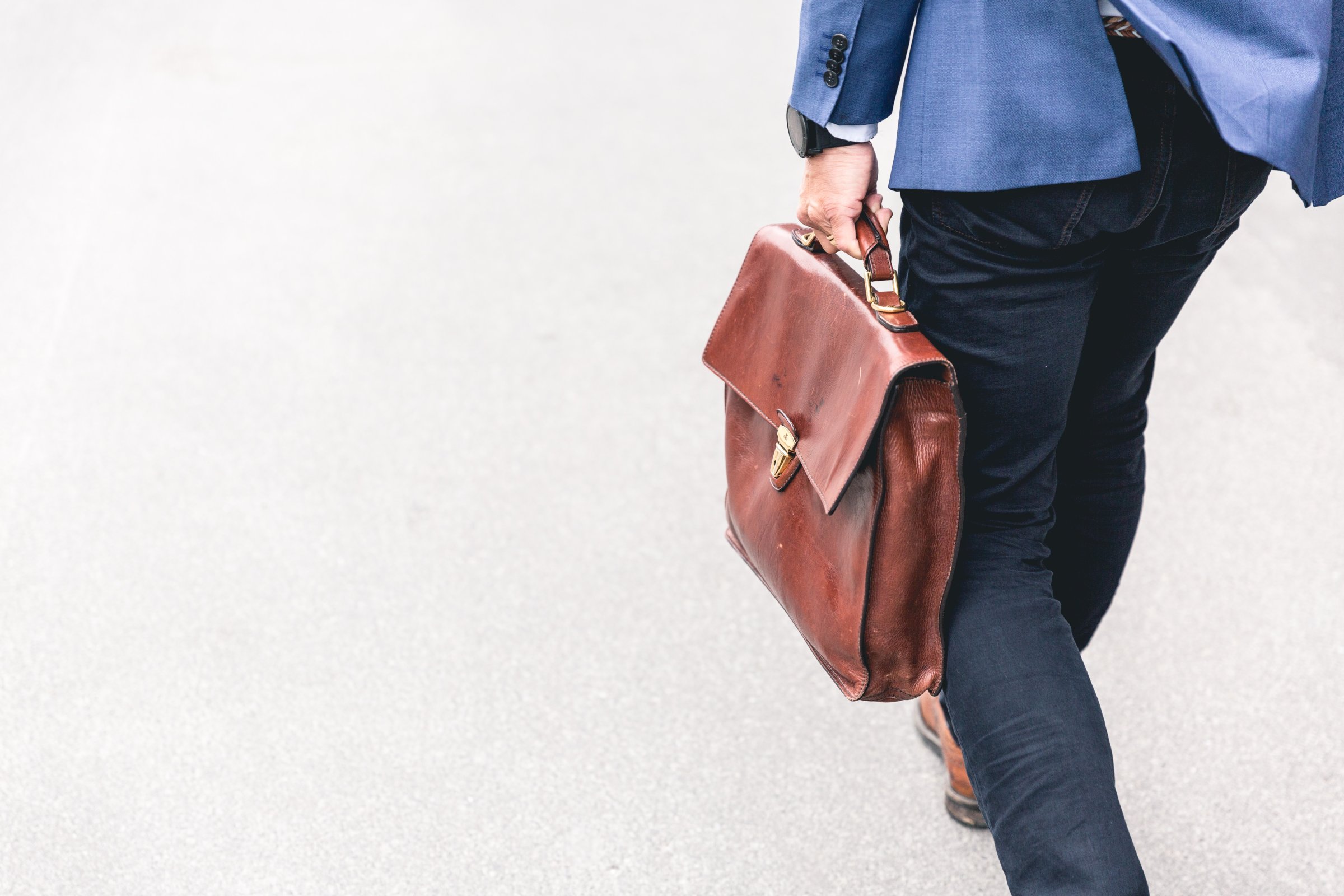 A business man holding a bag and having Seamless Onboarding Experience