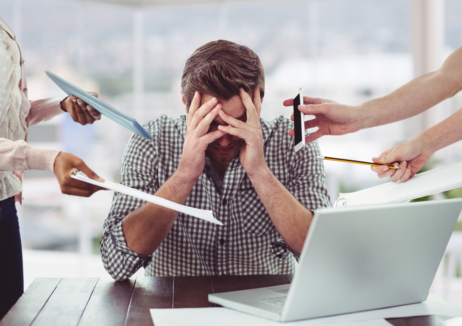 Project Management Stress Management - man frustrated with electronic devices