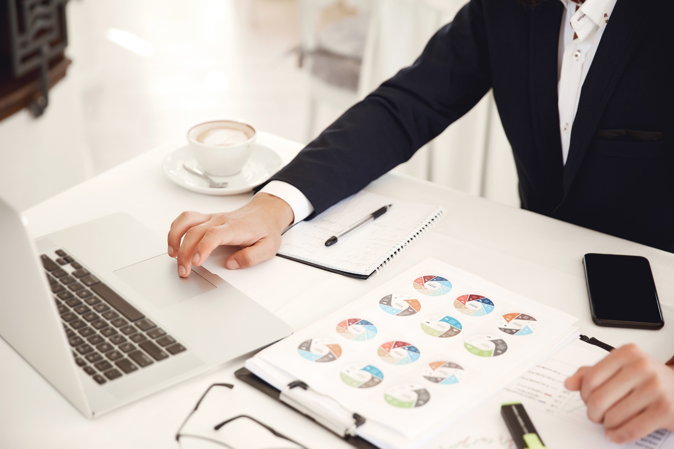 Cropped front view of a businessman working place Benefits of Business Project Portfolio Management