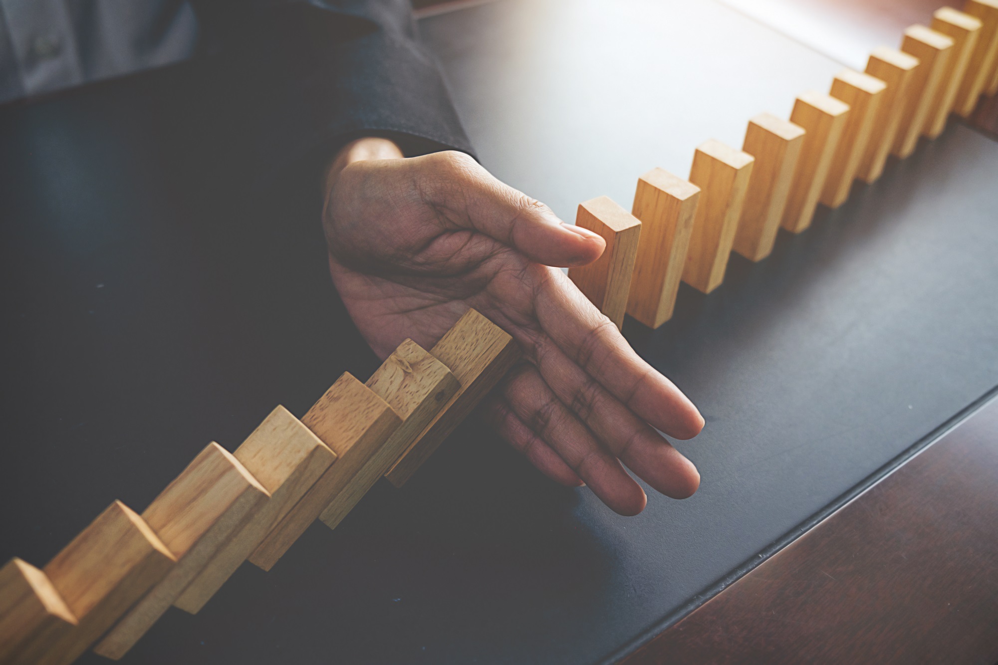 Problem Solving,Close up view on hand of business woman stopping showing the risks of outsourcing project management